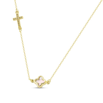 Γυναικείο κολιέ από χρυσό 14 καρατών με μικρό στρογγυλεμένο σταυρουδάκι. Το εσωτερικό του είναι όστρακο φίλντισι και δίπλα διαθέτει ένα μικρό σταυρουδάκι στολισμένο με ζιργκόν.